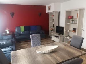 a living room with a table and a couch at Casa 33 in Lagos