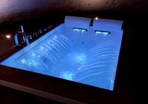 a blue sink with a faucet in a bathroom at L'Artiere Dimore nei Sassi in Matera