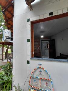 a building with a colorful decoration on the side of it at POUSADA Botos de Alter quarto compartilhado in Alter do Chao