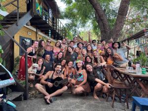 a group of people posing for a picture at Pipa Surf House in Pipa