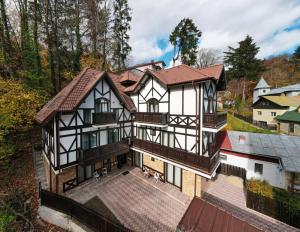 an aerial view of a house in a village at Hotel Perla in Sinaia