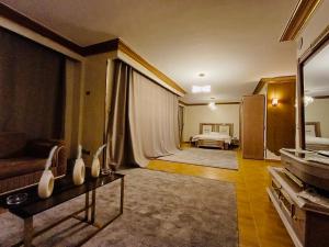 a living room with a couch and a bed at قصر فنيسيا 6غرف للإيجار ViP Vienice Palace luxury in 6th Of October