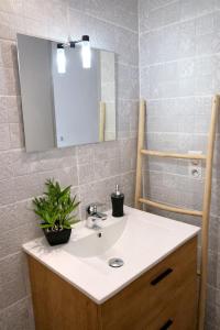 a bathroom with a sink and a mirror at Suite historique classée Avignon intra-muros in Avignon +10 photos