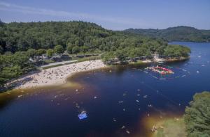 an aerial view of a beach with boats in the water at La Cigalienne in Treignac +5 photos