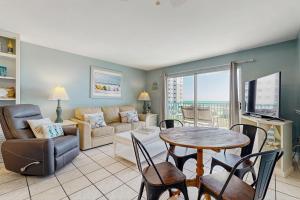 a living room with a couch and a table at Plantation Palms 6305 in Gulf Highlands