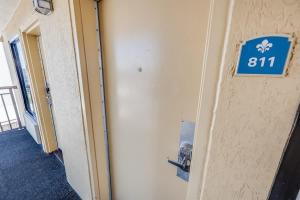 a blue sign on the wall of a hallway at Prime Ocean Frontage The Pavilion in Myrtle Beach