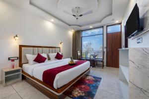 a bedroom with a large bed and a large window at Evening Sky Hotel - Kasauli !!! in Kasauli