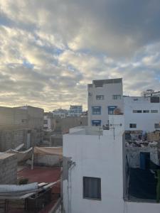 a view of a city from the roof of a building at yallah surf house in Taghazout