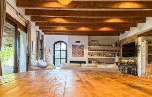 a large living room with a large wooden table at Holiday Home Finca Ses Tanques in Algaida