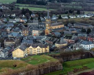 an aerial view of a town with a church at À la belle étoile in Rocroi