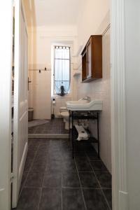 a bathroom with a sink and two toilets at Maison de Pi Sanremo in Sanremo +14 photos
