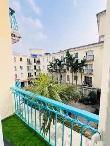 a balcony with a view of a building at Feel Goa at Poolview 2BHK Luxury Apartment in Arpora