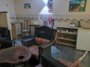 a living room filled with chairs and a table at palm nature lodge in Sanyang