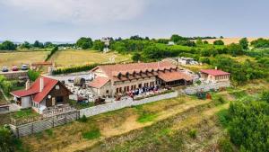an overhead view of a house with a group of people outside at István Pince a penzión in Šahy +32 photos