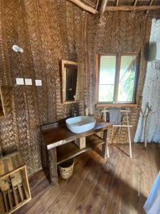 a bathroom with a sink on a wooden table at Baobab Lagoon in Mtende +38 photos