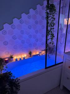 a swimming pool with candles and lights in a room at Sète en couleurs in Sète