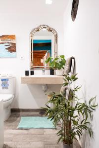 a bathroom with a sink and a mirror at Cabin in front of idyllic majanicho beach in Majanicho +22 photos