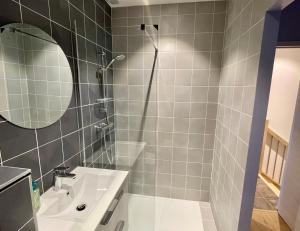 a bathroom with a shower and a sink at WOLALYs MH in Mercury +18 photos