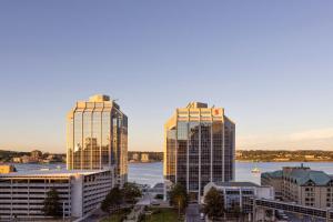 a city skyline with tall buildings and a river at Delta Hotels by Marriott Halifax Downtown in Halifax