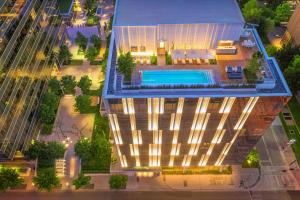 an overhead view of a building with a swimming pool at HALL Arts Hotel, Dallas, Autograph Collection in Dallas
