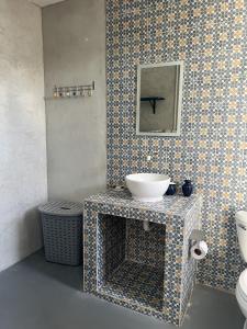 a bathroom with a sink and a toilet at Casa Azul en Centro de Mérida in Mérida +92 photos