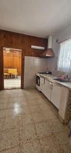 a kitchen with a stove and a counter top at Lo de Nilda in Playa Unión