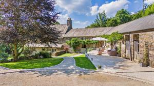 an exterior view of a stone house with a driveway at 2 Bed in Kelly oc-k29333 in Kelly