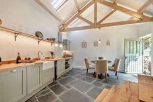 a kitchen with a table and a dining room at 2 Bed in Kelly oc-k29333 in Kelly +21 photos