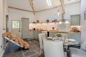 a kitchen with a table and chairs and a counter at 2 Bed in Kelly oc-k29333 in Kelly