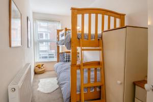 a small bedroom with a bunk bed and a ladder at 2 Bed in Cromer oc-t29986 in Cromer