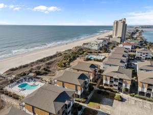 an aerial view of the beach and condos at OIB90 Endless Summer in Ocean Isle Beach