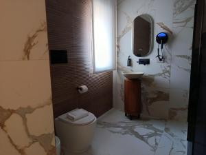 a bathroom with a toilet and a sink at Ursino inn camere e suite in Catania +81 photos