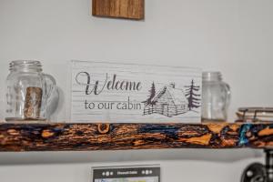 a sign sitting on top of a stove at Chesnutt Cabin - Riverfront, Fire Pit, Game Room, Wifi, Screen Porch, View, King Bed in Morton Grove