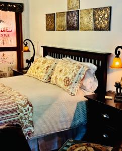 a bed with two pillows on top of it at Magnolia Petal Accommodation in Salt Spring Island