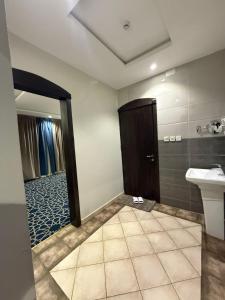 a bathroom with a toilet and a sink and a shower at شاليهات وشقق ليالي رهيف in Abha +33 photos