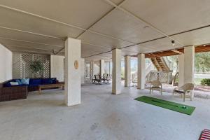 an empty living room with a ping pong table at SB25A Clubhouse Villa 2BR in Sunset Beach