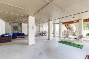 a large living room with a ping pong table at SB25 Clubhouse Villa 3BR in Sunset Beach