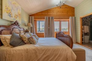 a bedroom with a bed and a large window at Rustic Villa Retreat in Pinoso +17 photos