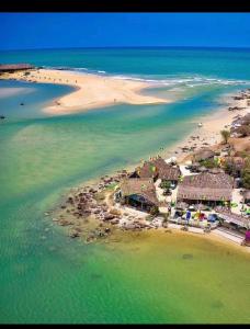 an aerial view of a beach with houses and the ocean at La villa Bella Vista in Somone