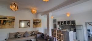 a living room with a couch and a stove at city garden Kech in Marrakesh