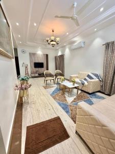 a living room with a couch and a table at Dar E Noor in Hyderabad