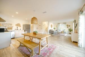 a kitchen and living room with a wooden table at Noon on Sunset Hill in Los Angeles +39 photos