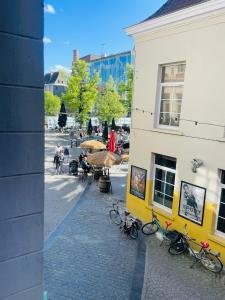 a group of bikes parked next to a building at Alcazar in Mechelen