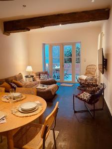 a living room with a table and a couch at Alcazar in Mechelen