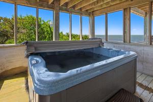 a large bath tub in a room with windows at 8650 - Mare Vista Retreat in Frisco