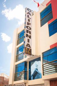 a building with a sign on the side of it at Hotel California in Juliaca