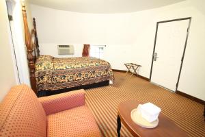 Un ou plusieurs lits dans un hébergement de l'établissement Wigwam Motel