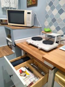 a microwave oven sitting on top of a table at Arthouse in Molfetta +19 photos