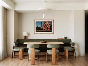 a dining room with a table and chairs at The Atlas Hotel in Boston