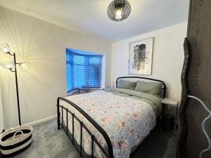 a bedroom with a bed and a window at The Annexe in Peacehaven +11 photos